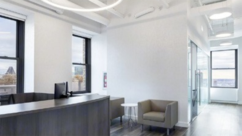 Alternate view of reception desk and seating area at 220 E 42nd St, New York