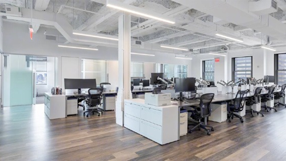 Open concept area with workstations at 220 E 42nd St, New York